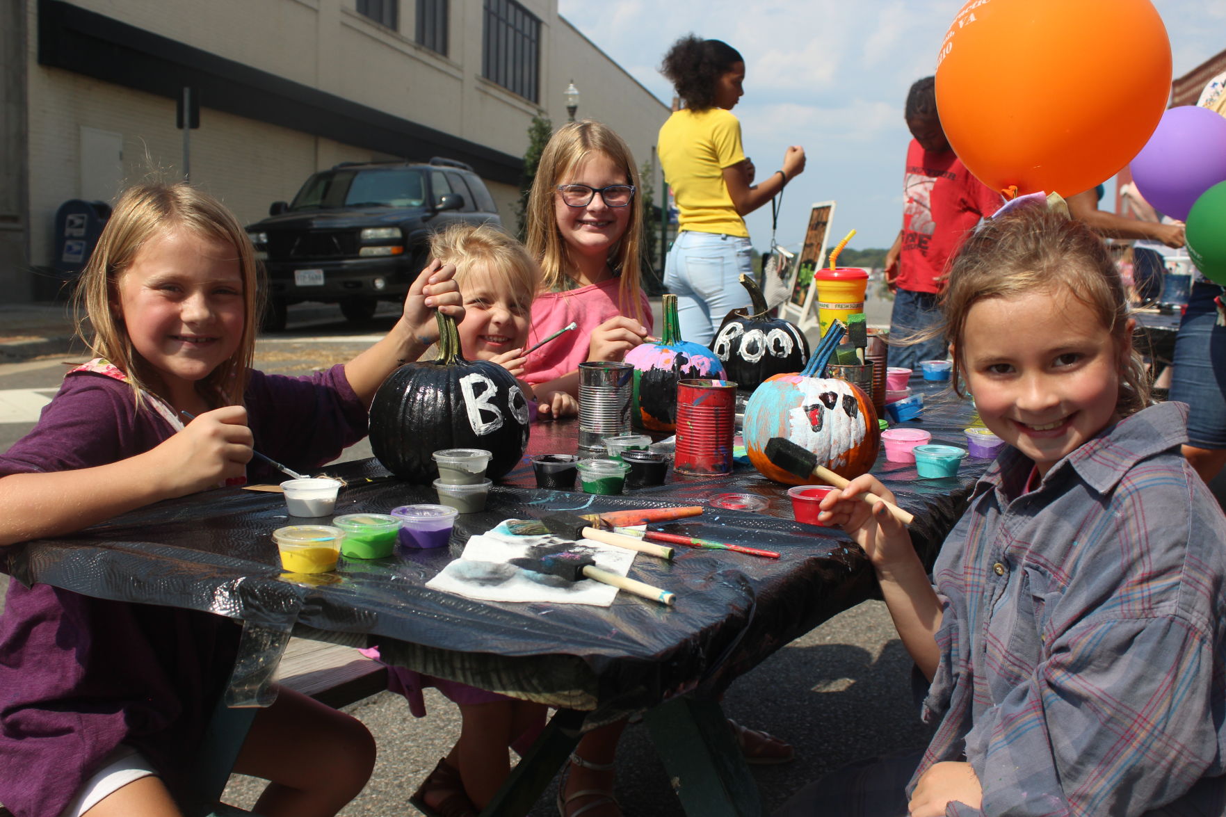 Bogan family painting pumkins.JPG